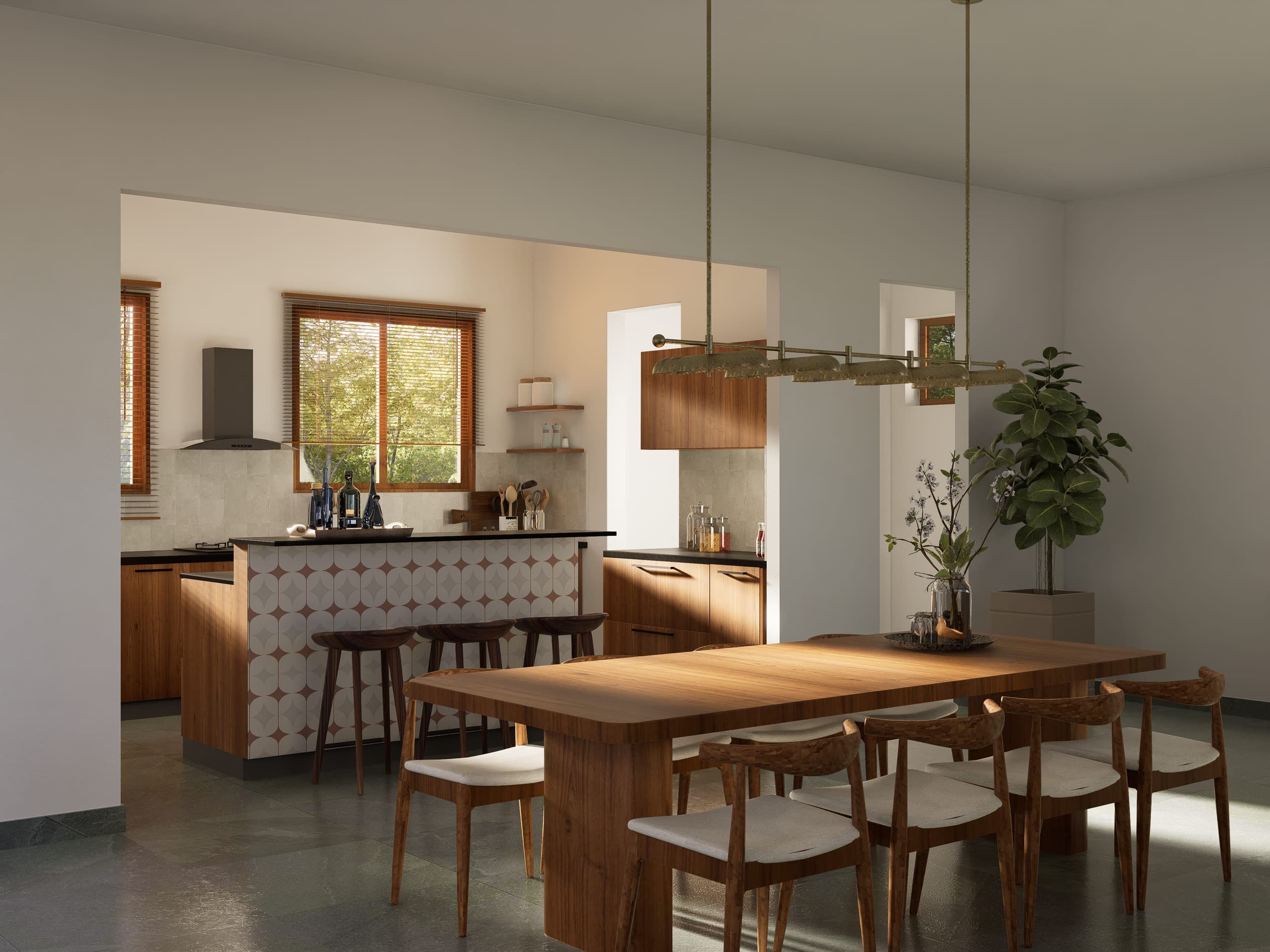 Kitchen and dining sit in direct dialogue, separated by an island counter faced in patterned encaustic tile. Plantation-facing windows keep the kitchen part of the landscape rather than a room apart.