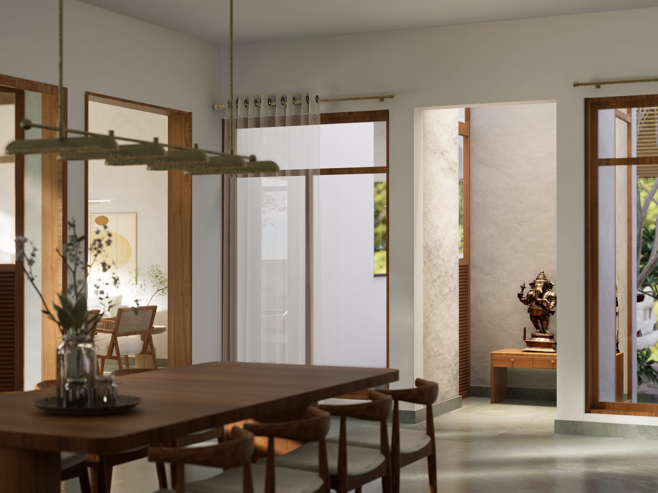 The pooja room is set back in its own niche straight ahead, a bronze Ganesha marking the threshold.