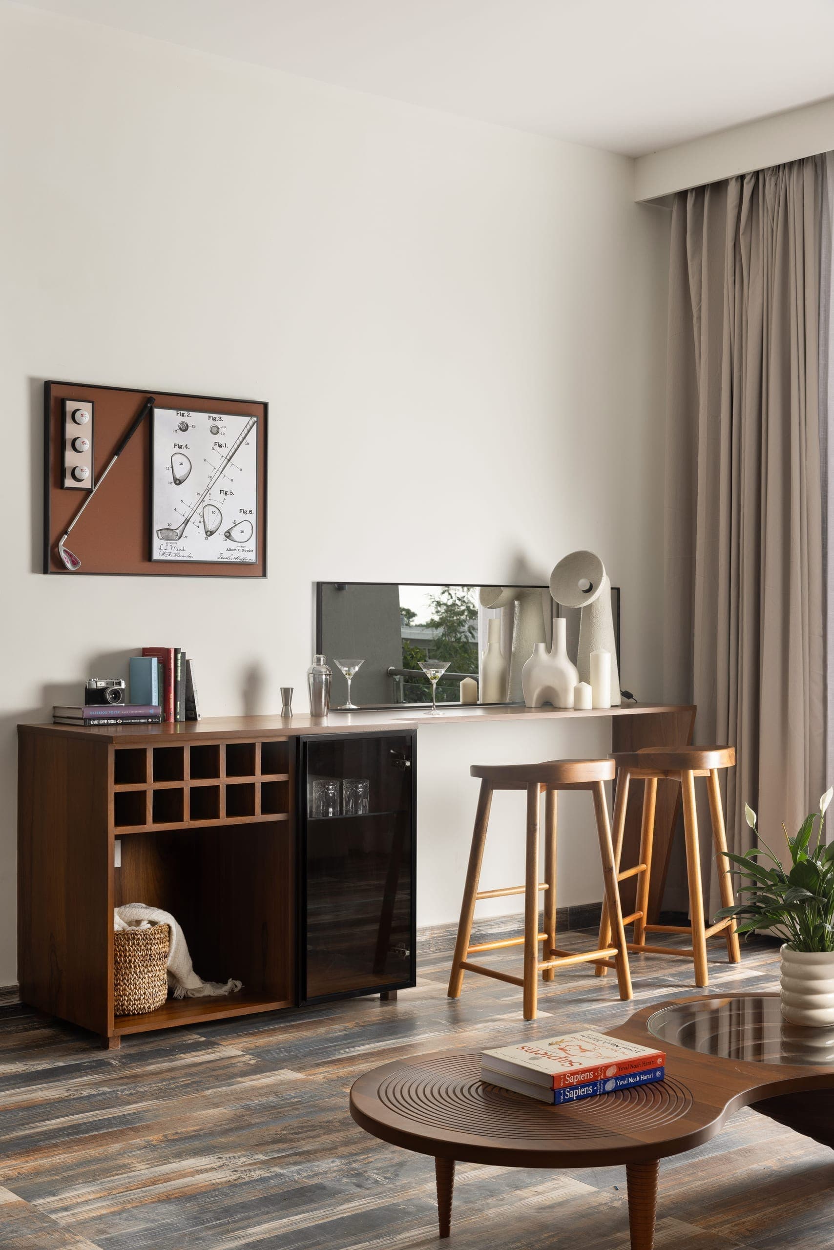 Layered in warm neutrals and natural textures, the bedroom is designed for ease. Upholstered surfaces, soft drapery, and integrated storage keep the space calm and uncluttered.